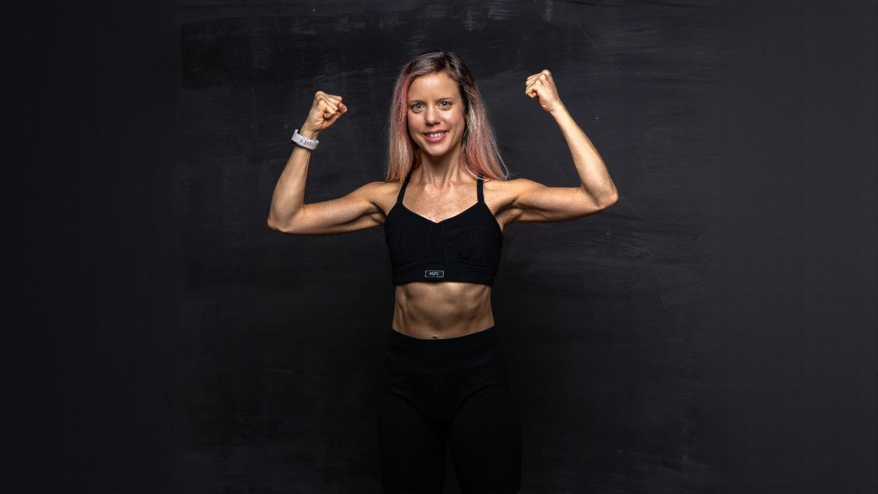 Woman stretching gently in a sunlit room